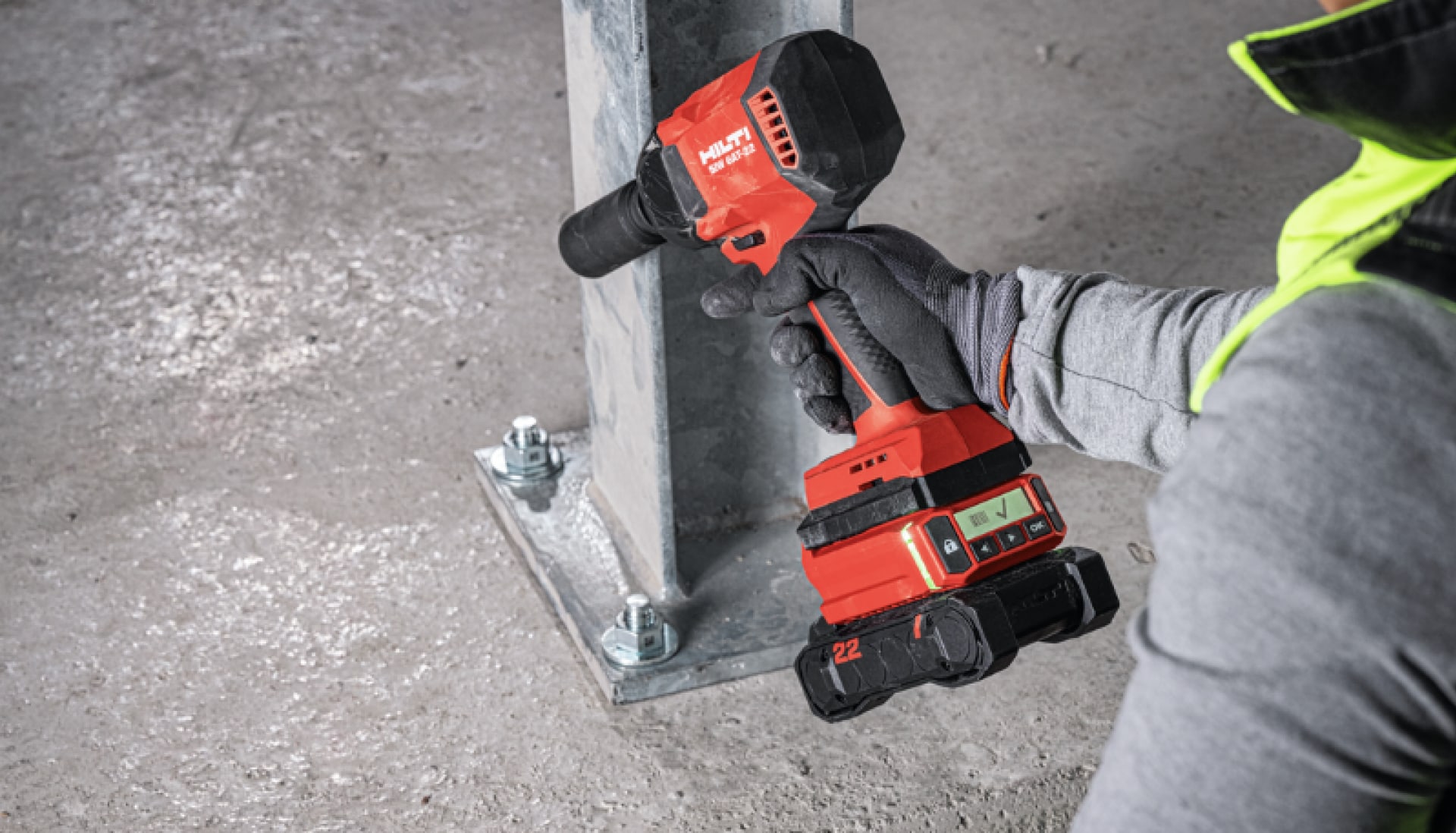 Worker checking the anchor installation status on Hilti SIW 6AT-22