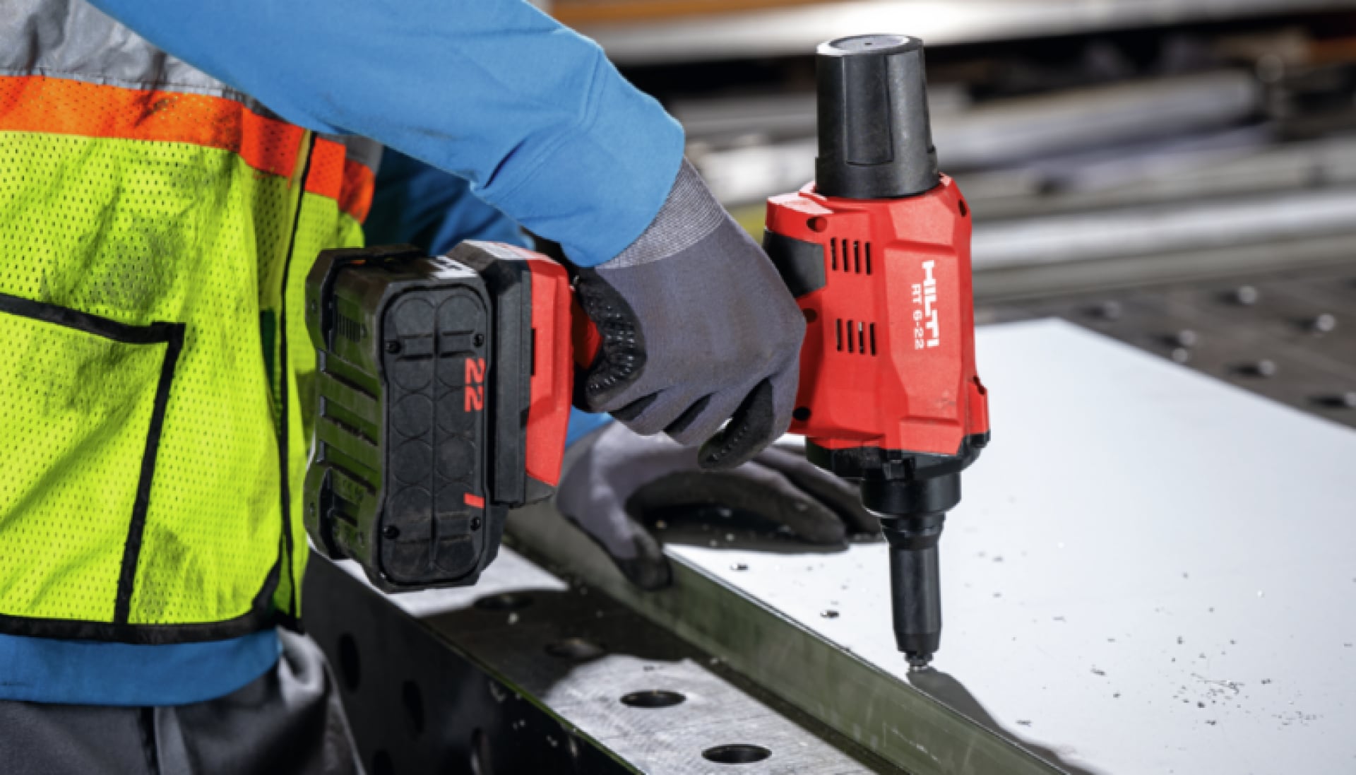 Worker using Hilti RT 6-22 for riveting metal sheets
