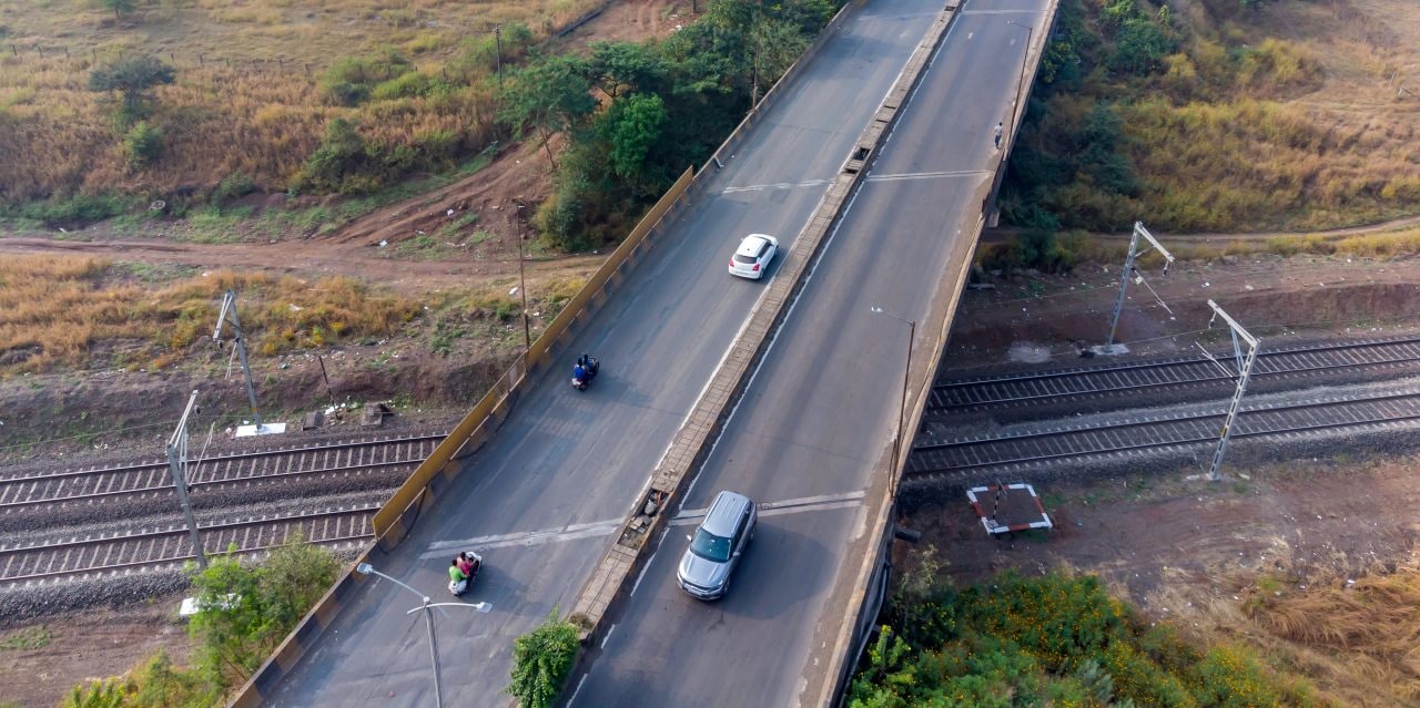 Aerial view of a road bridge over railway tracks at Telegaon near Pune India.